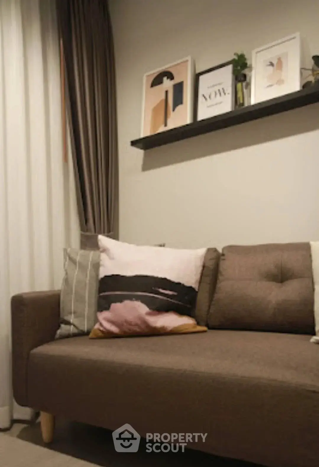 Cozy living room with stylish sofa and modern wall art