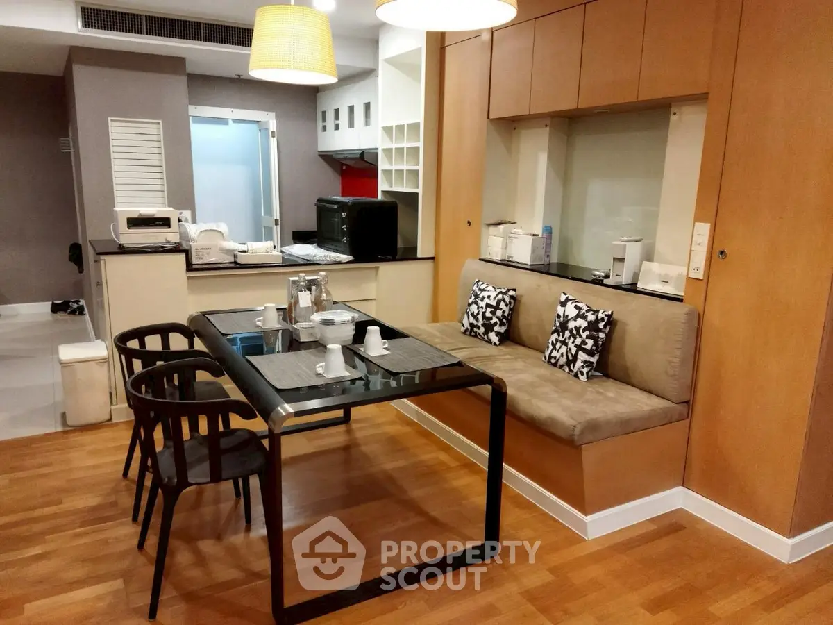 Modern dining area with stylish seating and open kitchen layout