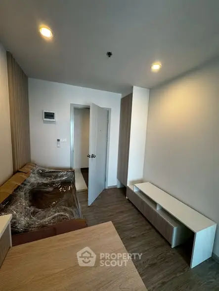 Modern living room with sleek furniture and wooden flooring