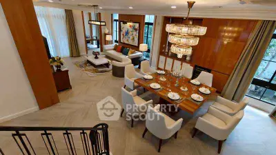 Luxurious open-plan living and dining area with elegant decor and large windows.