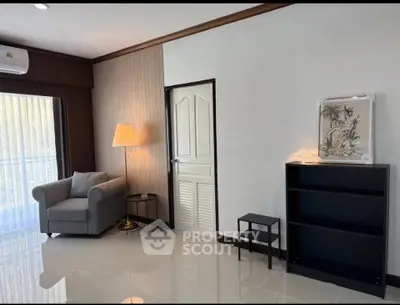 Modern living room with cozy armchair and stylish decor