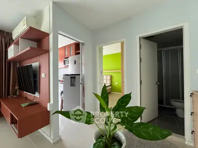 Modern apartment interior with open layout, featuring a kitchen, living area, and stylish decor.