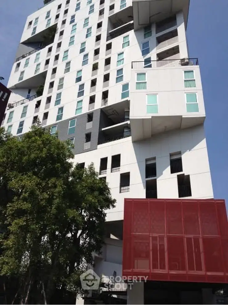 Modern architectural building with unique design and large windows.