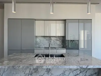 Luxurious modern kitchen with marble countertops and sleek cabinetry