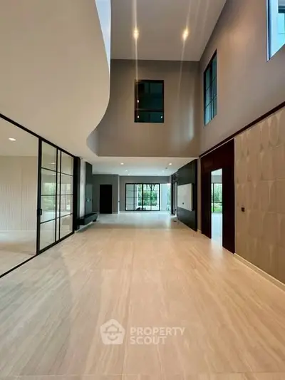 Spacious modern living room with high ceilings and elegant design