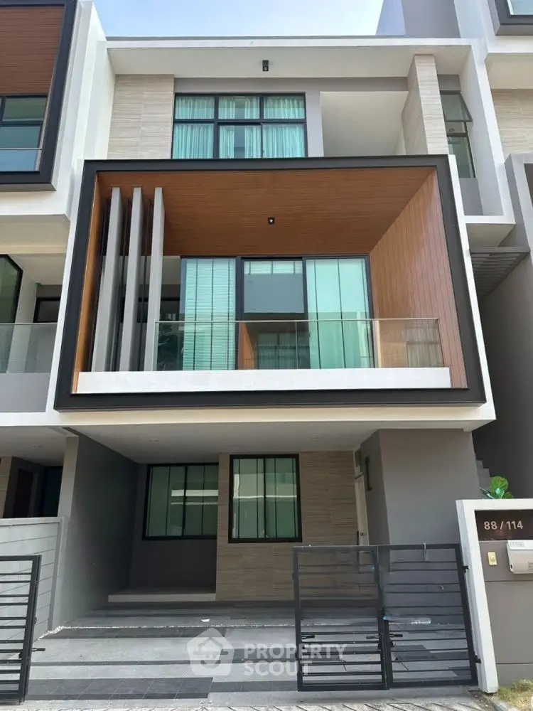 Modern townhouse exterior with sleek design and large windows