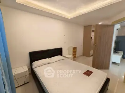 Spacious bedroom with modern design and ample natural light