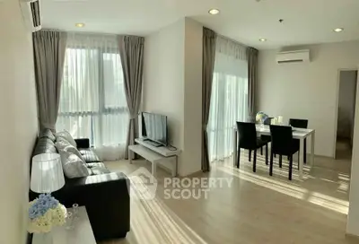 Spacious modern living room with dining area and natural light