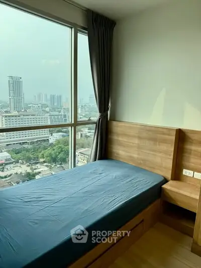 Cozy bedroom with stunning city view and modern wooden furnishings
