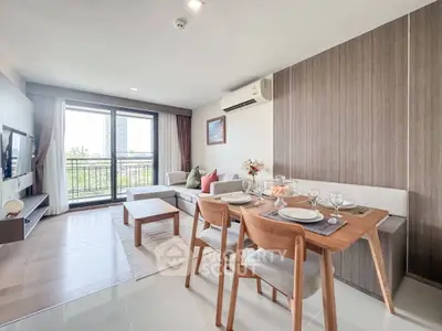 Modern living room with dining area and balcony view in a stylish apartment.