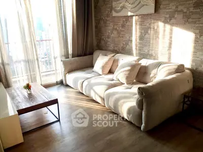 Stylish living room with cozy sofa and natural light in modern apartment