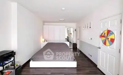 Spacious modern bedroom with sleek design and ample storage