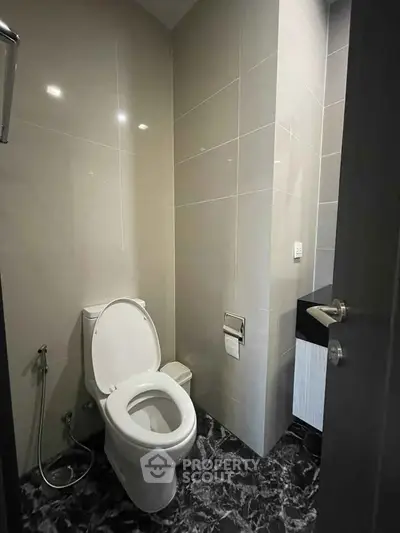 Modern bathroom with sleek tiles and contemporary fixtures