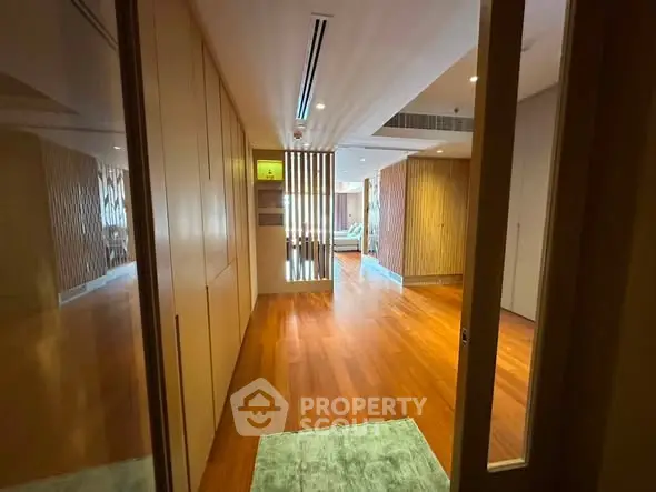 Spacious modern living room with wooden flooring and elegant design