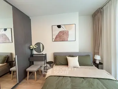 Modern bedroom with stylish decor, featuring a cozy bed, elegant artwork, and a sleek vanity mirror.