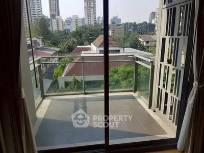 Spacious balcony with city view in modern apartment