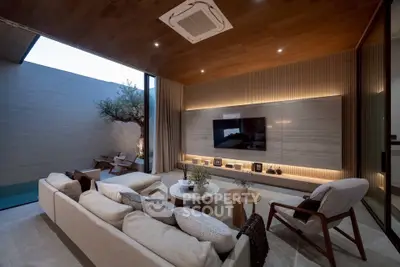 Luxurious modern living room with open layout and stylish decor, featuring a cozy seating area and outdoor view.