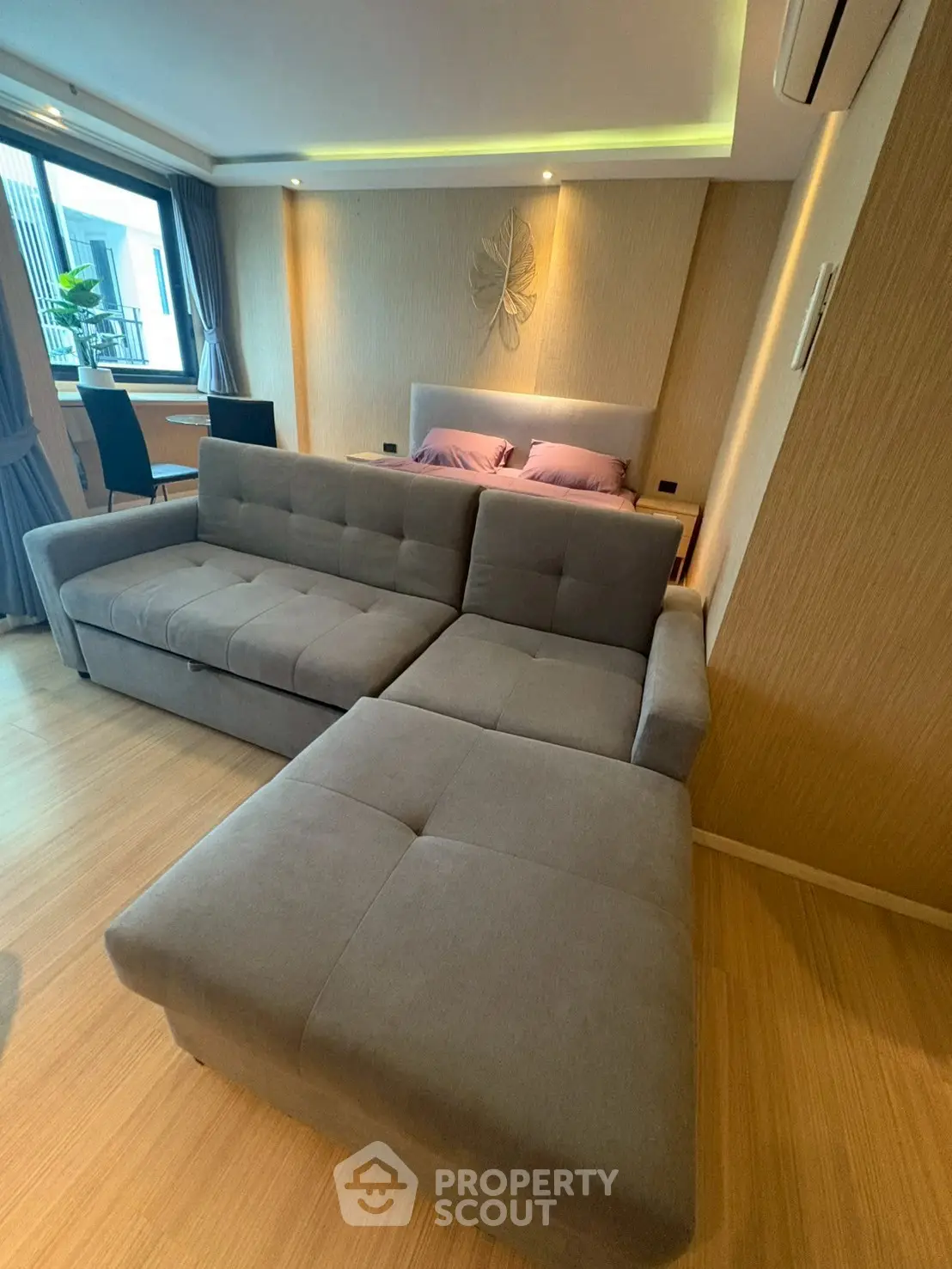 Modern living room with stylish gray sectional sofa and elegant decor