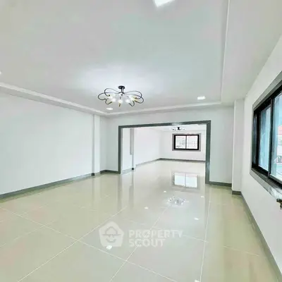 Spacious modern living room with elegant lighting and large windows