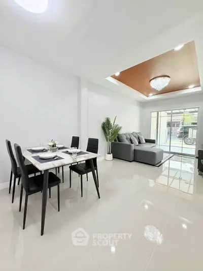 Modern living room with elegant dining area and stylish decor