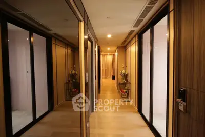 Luxurious hallway with mirrored walls and elegant lighting in modern apartment