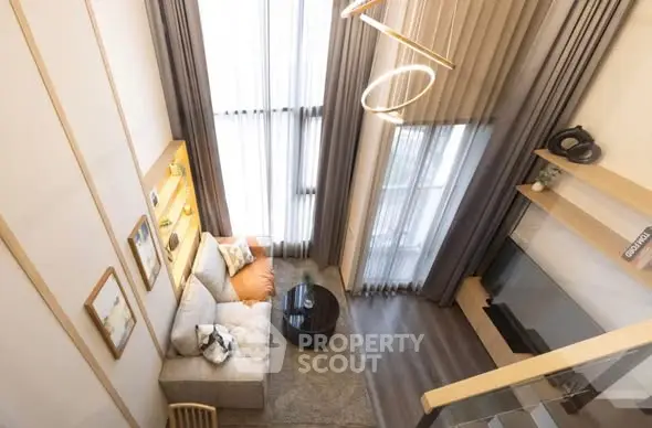 Modern loft-style living room with high ceilings and elegant decor