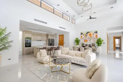 Luxurious open-plan living room with modern kitchen and elegant decor