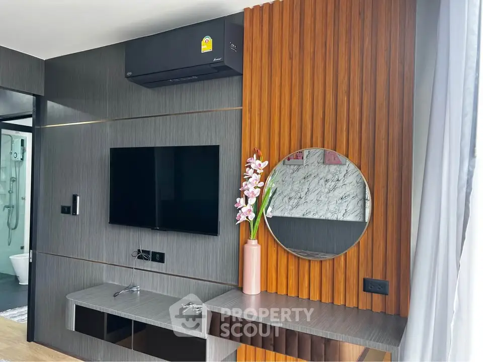 Modern living room with sleek TV setup and stylish decor