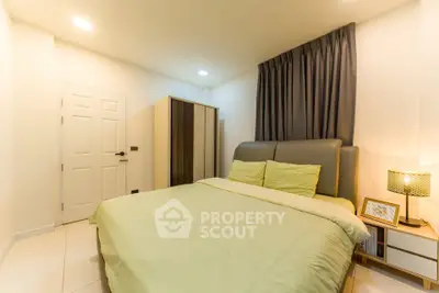 Cozy bedroom with modern decor and ample storage space, perfect for relaxation and comfort.