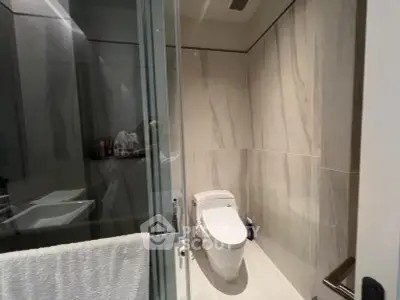 Modern bathroom with sleek design and glass shower enclosure