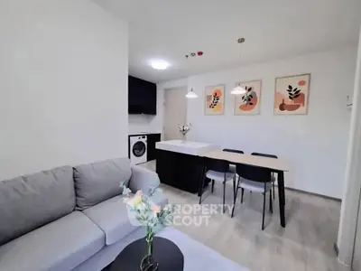 Modern living room with stylish decor and open dining area