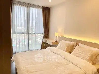 Bright and cozy bedroom with city view and modern decor