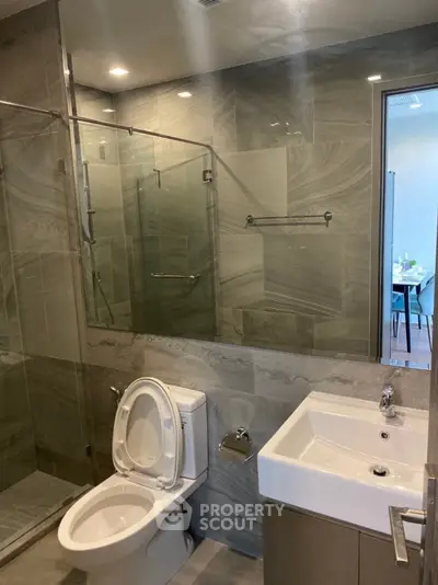 Modern bathroom with glass shower and sleek fixtures
