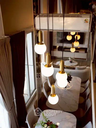 Luxurious modern living room with elegant lighting and stylish dining area