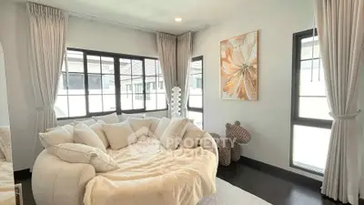 Elegant living room with plush white sofa and modern decor