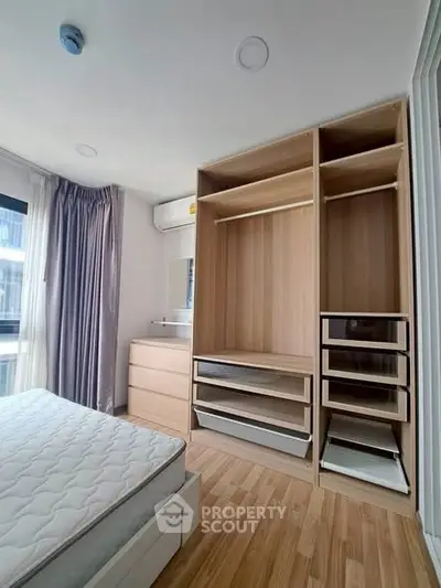 Spacious bedroom with built-in wardrobe and natural light