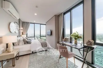 Luxurious bedroom with stunning city view, elegant decor, and modern furnishings in a high-rise apartment.
