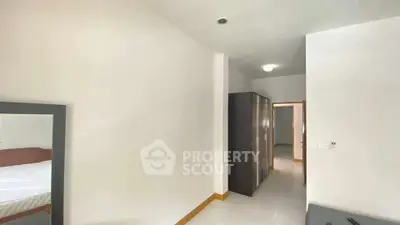 Spacious bedroom with modern wardrobe and minimalist decor