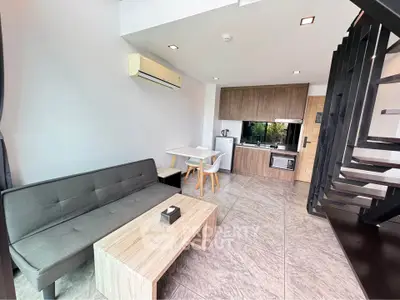 Modern loft apartment with sleek kitchen and stylish living area