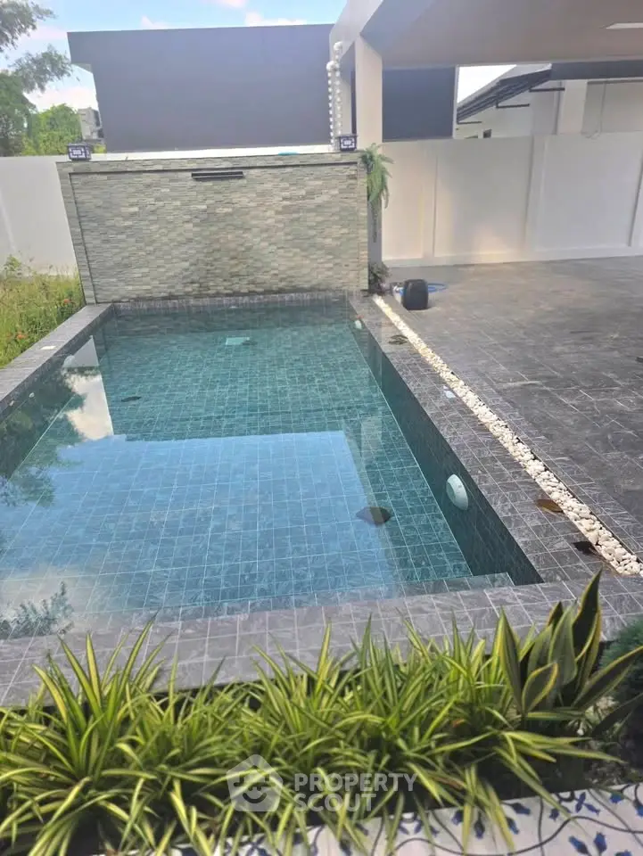 Luxurious modern home with private pool and stylish outdoor area, perfect for relaxation and entertainment.