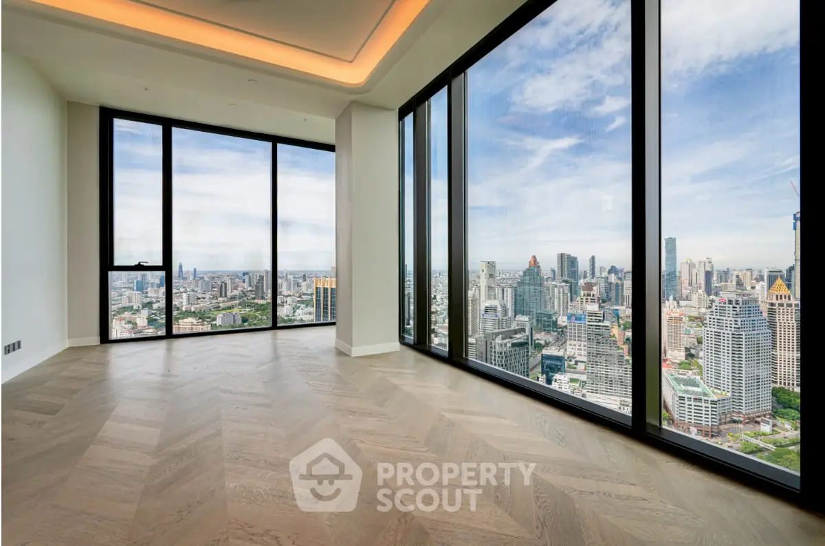 Luxurious corner unit with panoramic city views and elegant flooring.