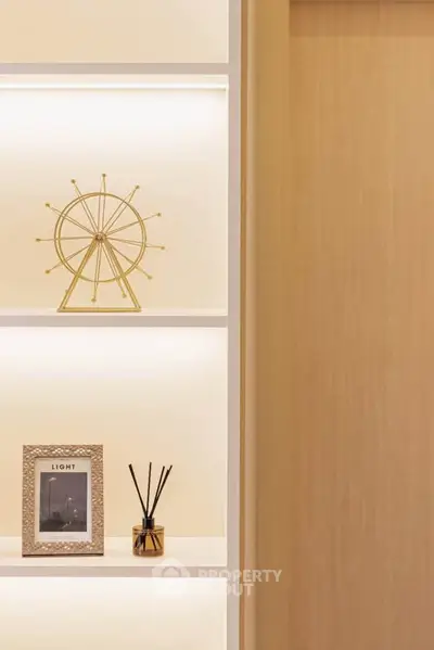 Stylish modern interior shelf with decorative items and soft lighting, perfect for enhancing living spaces.