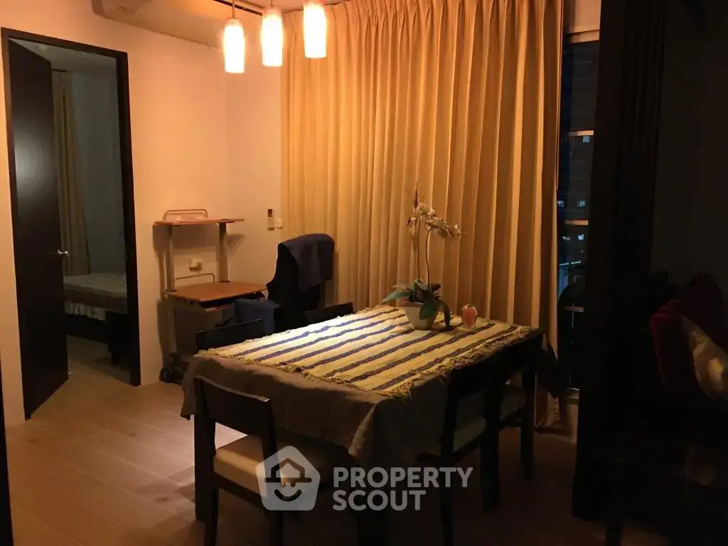 Cozy dining area with warm lighting and elegant decor, perfect for intimate gatherings.