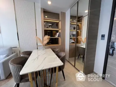 Modern dining area with elegant marble table and stylish chairs in a contemporary apartment