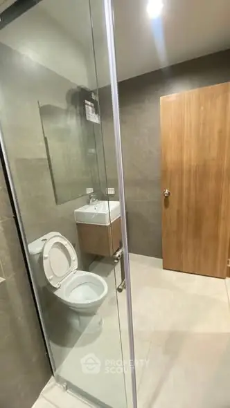 Modern bathroom with glass shower and sleek fixtures