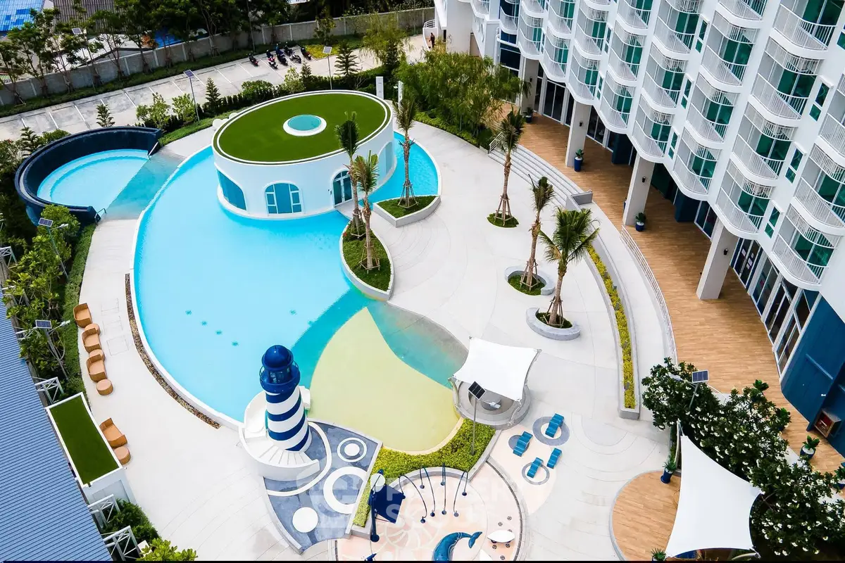 Luxurious resort-style pool area with modern architecture and lush landscaping.