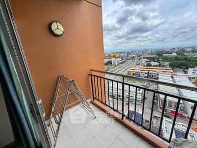 Spacious balcony with city view, perfect for relaxation and enjoying the skyline.