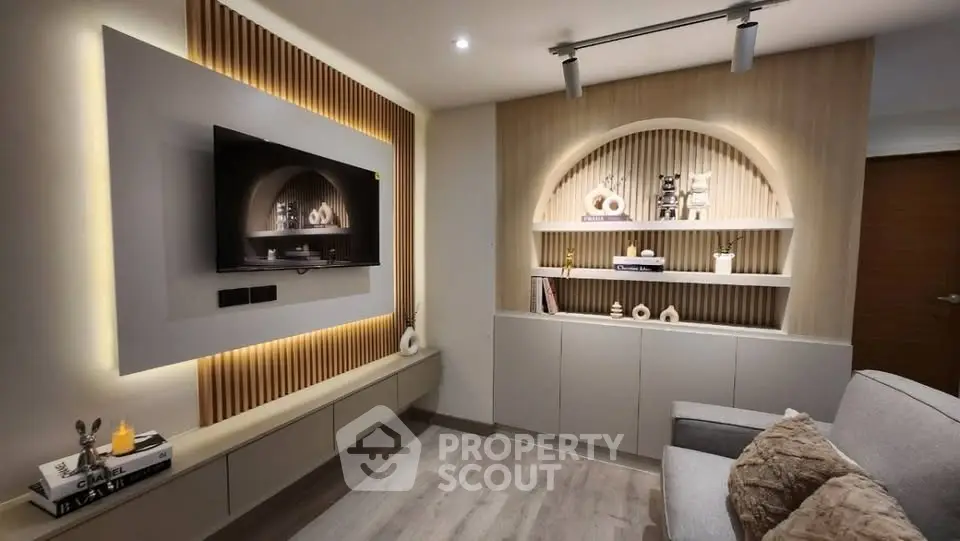 Modern living room with stylish wall decor and cozy lighting