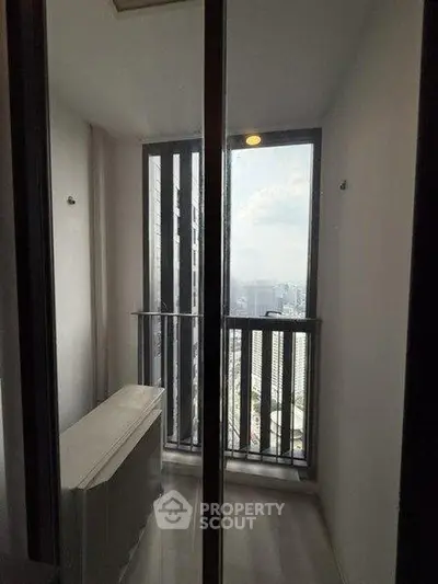 Modern balcony with city view in high-rise apartment