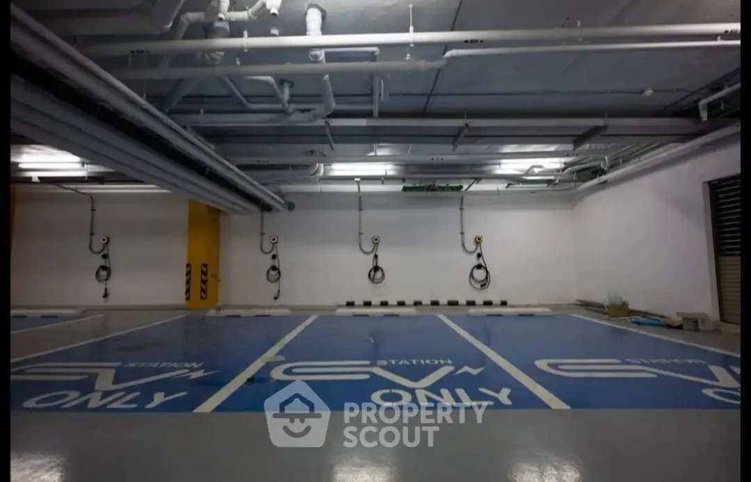Modern EV charging station in spacious underground parking area